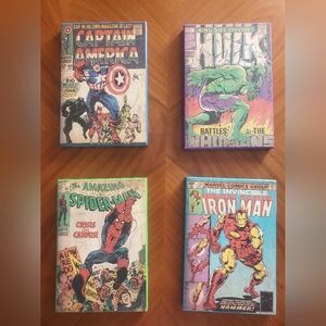 The prints of comic book covers on a wooden plank